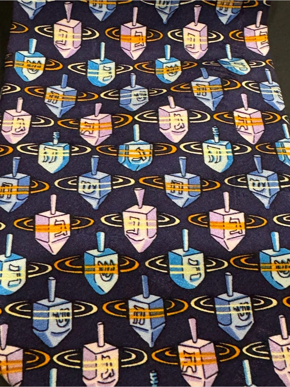 Hanukkah inspired silk tie with dreidel pattern by Nicole Miller NYC